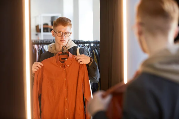 Moody Portrait Young Man Trying Clothes Fitting Room Thrift Shop — Stock Photo, Image