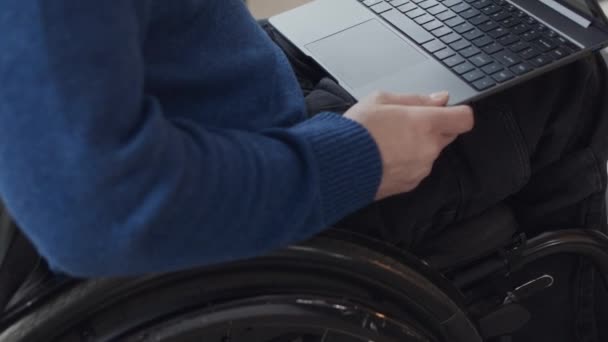 Tilt Shot Unrecognizable Man Wheelchair Looking Monthly Calendar Laptop Screen — Stock Video
