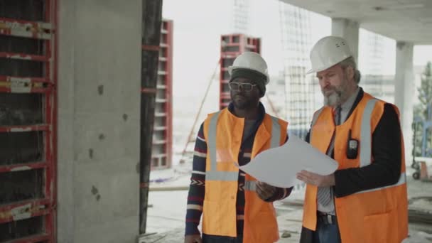 Medium Long Shot Two Ethnically Diverse Male Architects Wearing Safety — Stock Video