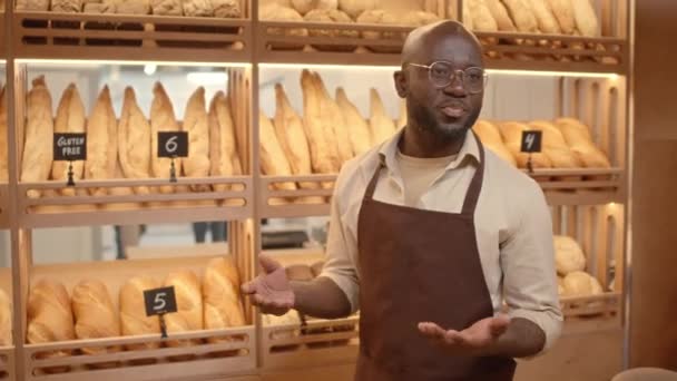 Medium Shot Young Black Man Presenting Various Types Bread Including — Stock Video
