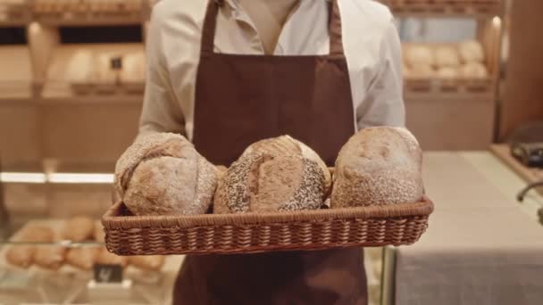 Cropped Slowmo Portrait Unrecognizable Bakery Worker Apron Holding Straw Tray — Stock Video
