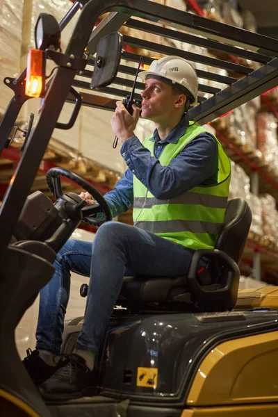 Vertical Portrait Young Male Worker Driving Forklift Truck Warehouse Speaking — Stock Photo, Image