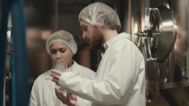 Medium Shot Two Ethnically Diverse Brewery Workers Lab Coats Smelling — Stock Video