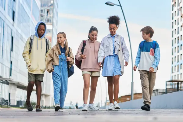 Row Multicultural Youngsters Casualwear Walking Street Talking Each Other While — Stock Photo, Image