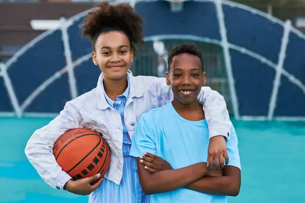 Happy Adolescent Girl Ball Embracing Her Friend Classmate Light Blue — Stock Photo, Image