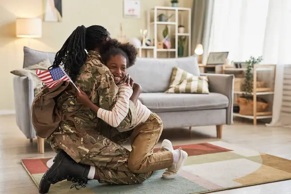 Little Girl American Flag Embracing Her Mom Camouflage Returning Home — Stock Photo, Image