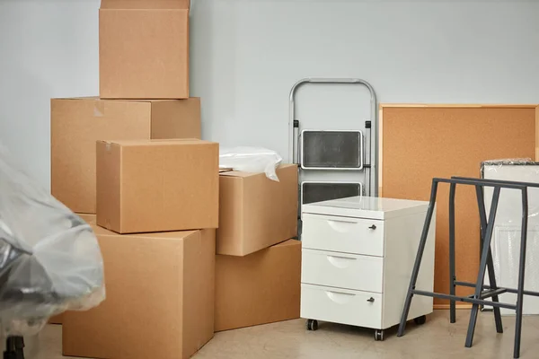 Horizontal image of Things packing in cardboard containers for relocation in new office