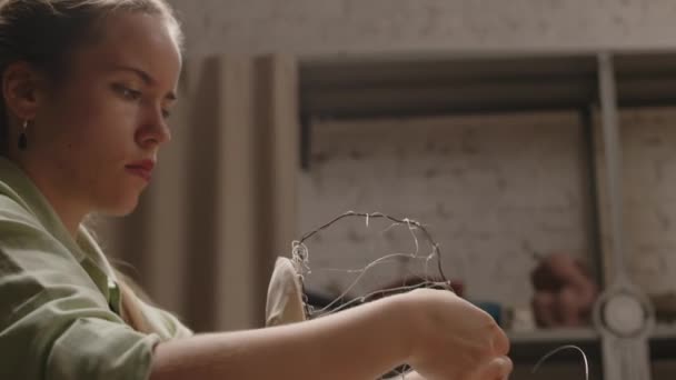 Waist Concentrated Young Caucasian Female Sculptor Using Armature Wire While — Stock Video