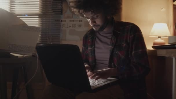 Medium Shot Middle Eastern Programmer Messy Curly Hair Sitting Dark — Stock Video