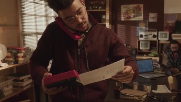 Medium Shot Young Biracial Hipster Guy Studying Documents Speaking Vintage — Stock Video