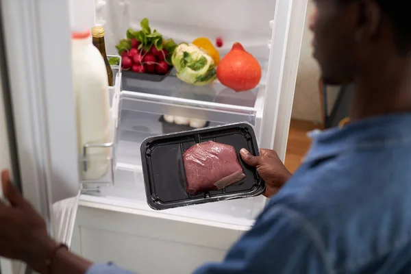 Closeup Young Black Man Taking Beef Out Refrigerator While Cooking — Stock Photo, Image