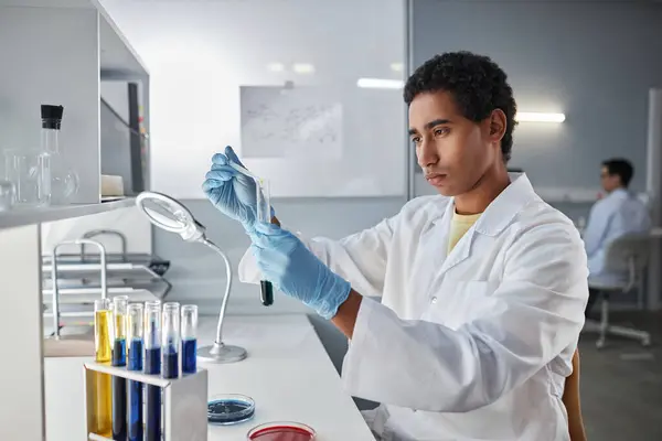 Side View Portrait Ethnic Young Man Holding Test Tube While — Stock Photo, Image