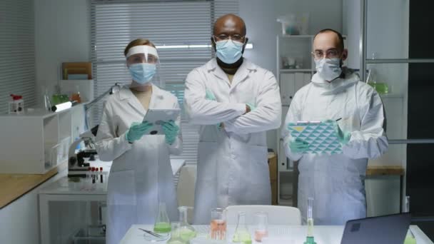 Medium Slowmo Portrait Multiethnic Group Three Scientists White Lab Coats — Stock Video