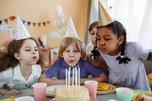 Diverse Group Happy Children Blowing Candles Cake Together Birthday Party Stock Image