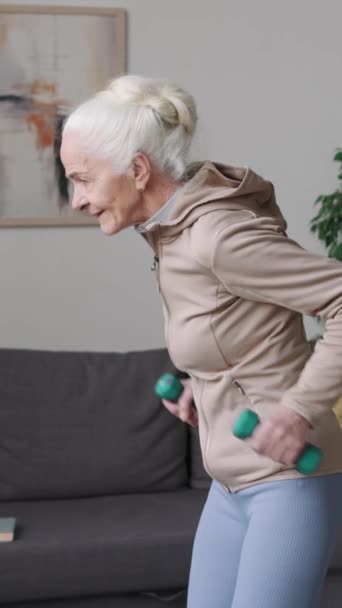 Vertical Medium Shot Caucasian Senior Woman Doing Triceps Kickback Exercise — Stock Video