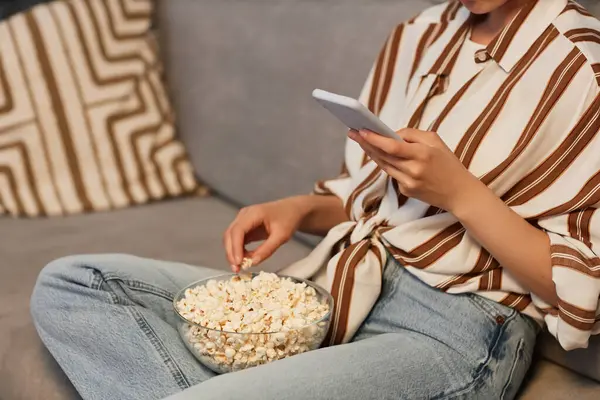 Closeup Unrecognizable Young Woman Relaxing Home Smartphone Eating Popcorn Copy — Stockfoto