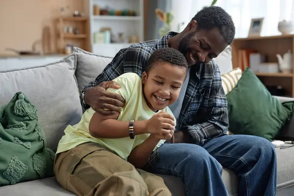 Candid Portrait Playful Father Son Sitting Couch Together Enjoying Family — Stock Photo, Image