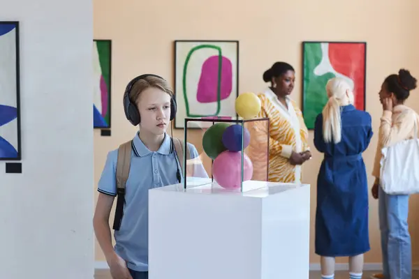Portrait Schoolboy Wearing Headphones Looking Abstract Art Sculpture Museum Copy — Stock Photo, Image