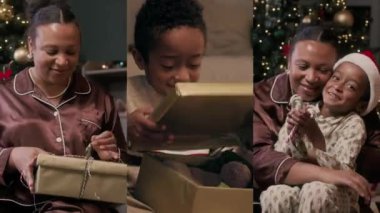 Neşeli Afrika kökenli Amerikalı anne ve oğulun Noel ağacına karşı oturma odasında oturup hediyeleri açması ve kucaklaşması.