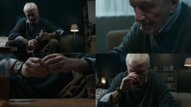 Eski karısının fotoğrafına bakan, evde viski içerken evlilik yüzüğünü çıkaran, stresin üstesinden alkolle gelmeye çalışan, üzgün, kır saçlı, beyaz saçlı, yaşlı bir adamın ekranını yarmak.