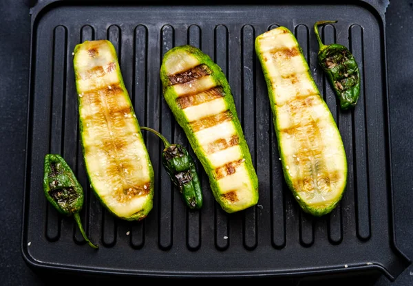 Grilled zucchini, pepper and carrots. Cooking delicious food at home on electric grill.