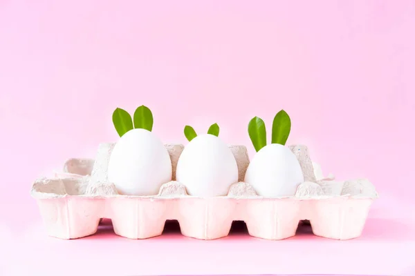 Easter eggs on pink background. Happy Easter concept. Bold hues for seasonal projects. Copy space