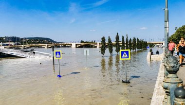 Natural disaster, flooding in Budapest near the Parliament in Hungary, high water level on the Danube clipart