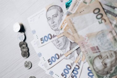 Three bundles of Ukrainian hryvnia money lie in pile. Currency of Ukraine. monetary system