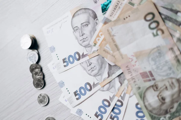 Three bundles of Ukrainian hryvnia money lie in pile. Currency of Ukraine. monetary system