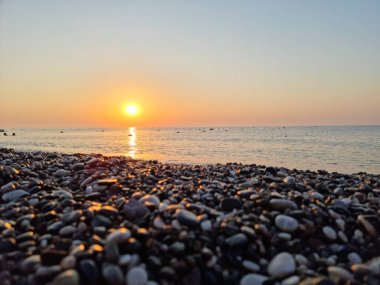 Turkish beach. Coastal resort with sea waves. Holidays, summer holidays abroad. beautiful sunset