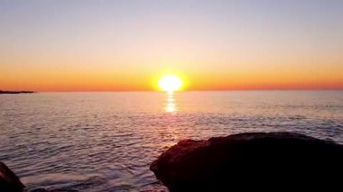 Tropical summer vacation by sea. Landscape with trees, lagoon and sunset. Holidays in tropics