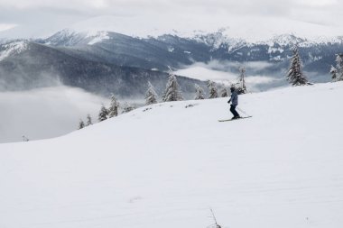 Dragobrat, Ukraine Foggy day people go to ski lifts to ski from Carpathian mountains
