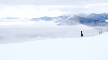 Dragobrat, Ukraine Foggy day people go to ski lifts to ski from Carpathian mountains