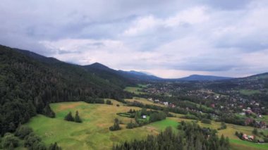 Drone view. Birds eye. Mountain landscape with forests and fields. Zakopane, Poland