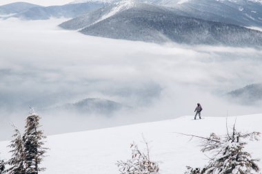 01.12.23 Ukraine, Dragobrat People go snowboarding and skiing from snowy mountains. Snow boarding in winter