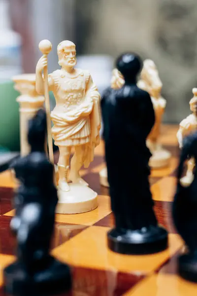 stock image Chess pieces are on board. Queen and king in chess are in difficult situation