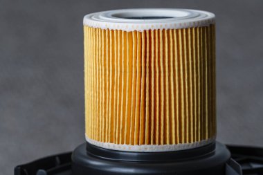 Cartridge filter for vacuum cleaner, close up. Filter for air purification for a healthy lifestyle housekeeping