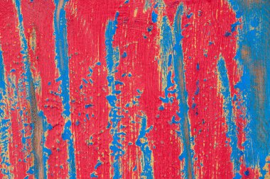 Red and blue painted old wooden background, bali island indonesia, close up