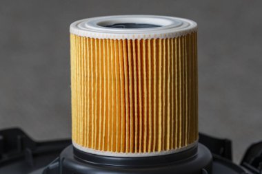 Cartridge filter for vacuum cleaner, close up. Filter for air purification for a healthy lifestyle housekeeping