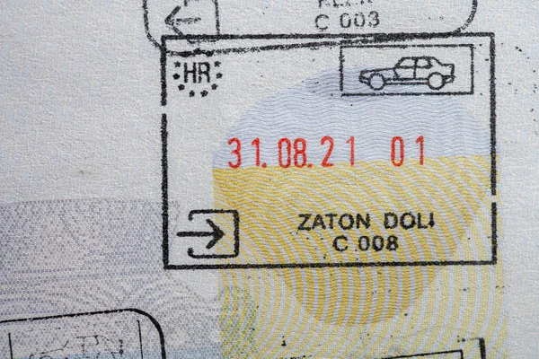 Close up detail of European Union border control customs admission stamps with car symbol. Inside page of a traveled Ukrainian passport with stamps from customs of Europe. Vacation and travel concept