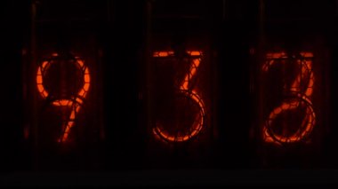 Retro vacuum tube display on the device counts seconds. Displaying numbers on a vintage lamp timer, close up, nixie tube indicator. Glow discharge indicator