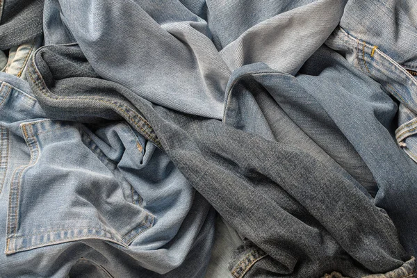 Dużo Pogniecionych Spodni Dżinsach Bliska Jeansowe Tło Koncepcja Zakupu Sprzedaży — Zdjęcie stockowe