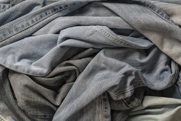 Bir Sürü Buruşuk Pantolon Yakın Çekim Denim Geçmişi Satın Alma — Stok fotoğraf