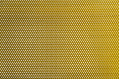 Bal dolu bir arı kovanından alınan balmumu bal peteğinin arka plan dokusu ve şablonu. Voshchina bal peteği yapımında yapay bir temel, hücrelerin balmumu tabakası