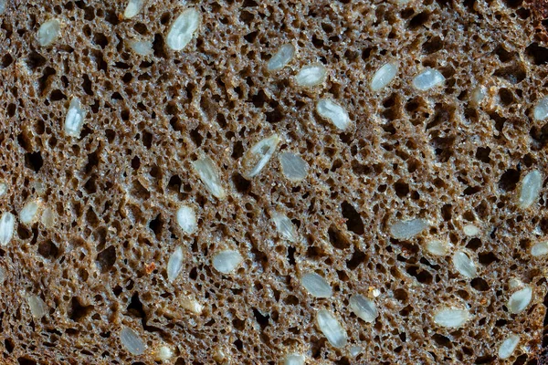 Abstraktní Pozadí Nebo Textura Domácí Černý Chléb Slunečnicovými Semínky Zblízka — Stock fotografie
