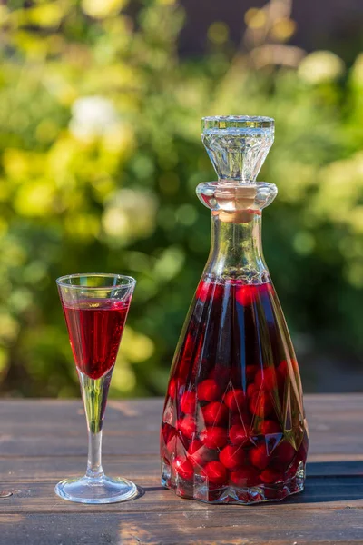 Homemade Red Cherry Brandy Glasses Glass Bottle Wooden Table Summer — Stock Photo, Image