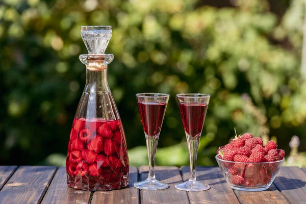 Homemade Red Raspberry Brandy Two Glasses Glass Bottle Wooden Table — Stock Photo, Image