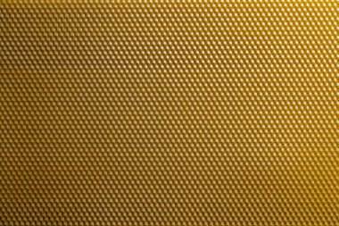 Bal dolu bir arı kovanından alınan balmumu bal peteğinin arka plan dokusu ve şablonu. Voshchina bal peteği yapımında yapay bir temel, hücrelerin balmumu tabakası