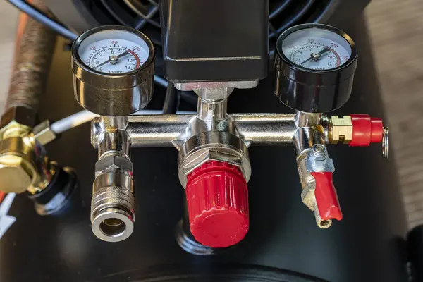 Pressure gauges, pressure measuring couplings in the air compressor , measuring instrument on pneumatic control system. Pressure differential gauge