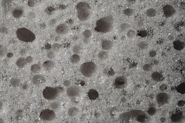 Sponge detail texture, sponge texture close up background. Cellulose sponge texture. Black and white
